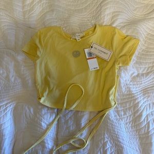 Yellow smiley face tee